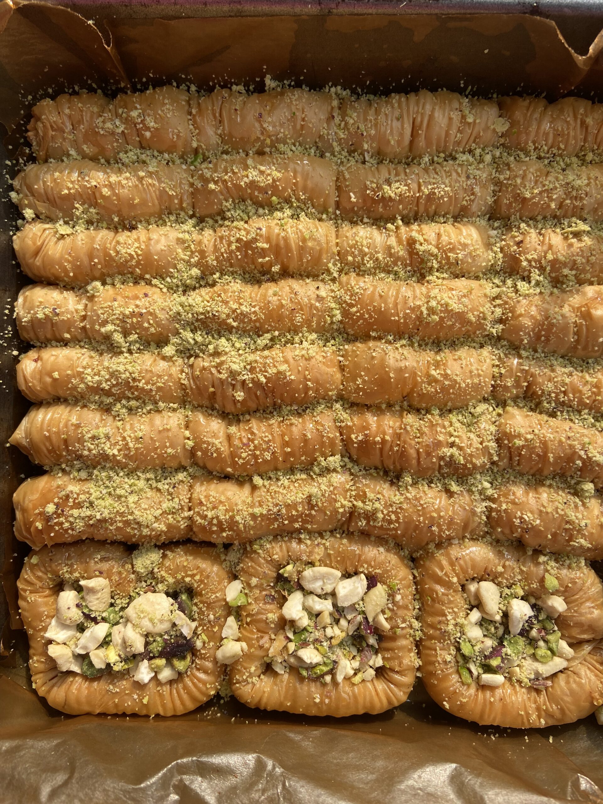 Baklava with almonds and pistachios drizzled with honey by best cake shop near me Salz Bakes